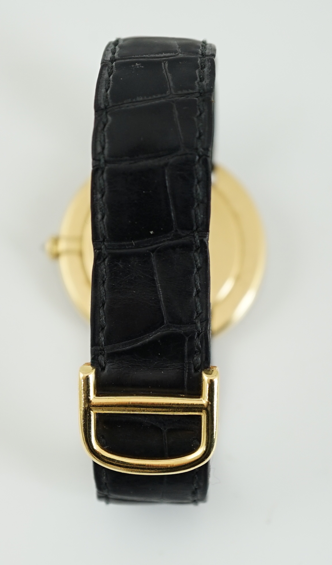 A lady's 18ct gold, black onyx and diamond set Cartier Vendome manual wind wrist watch